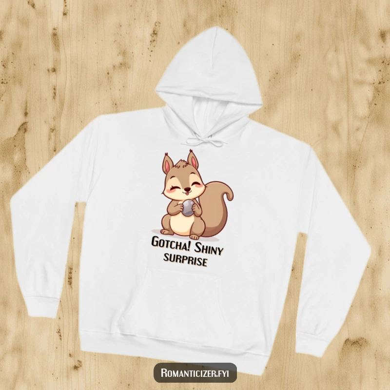 Funny hoodie showcasing a mischievous squirrel winking while holding a shiny pebble, offering warmth and playful gifting vibes.