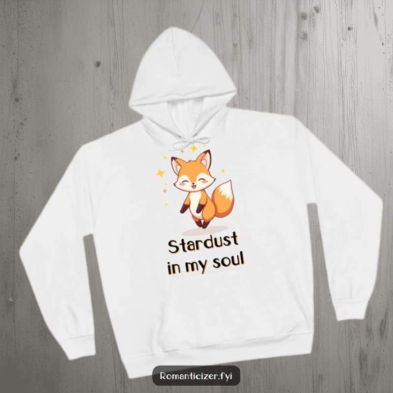 Funny Fox Hoodie: A cheerful fox is depicted twirling gracefully within a radiant halo of sparkling stars.