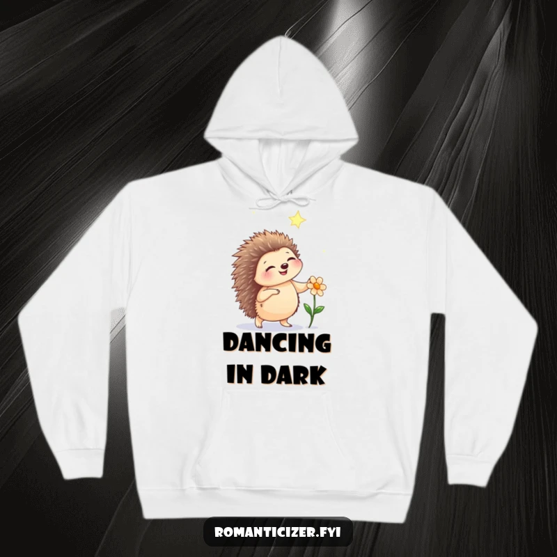 Funny hedgehog hoodie featuring a happy hedgehog dancing under a starry sky with a flower, embodying cozy nighttime magic.