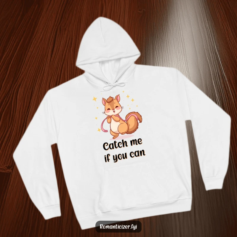 Funny hoodie depicting a playful squirrel twirling with a ribbon under a magical sky of sparkling stars.